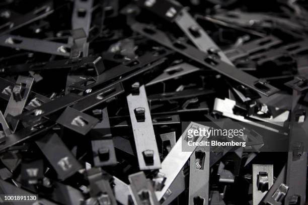 Metal brackets sit in a pile at a Stanley Black & Decker Inc. Craftsman Tools manufacturing facility in Sedalia, Missouri, U.S., on Tuesday, July 17,...