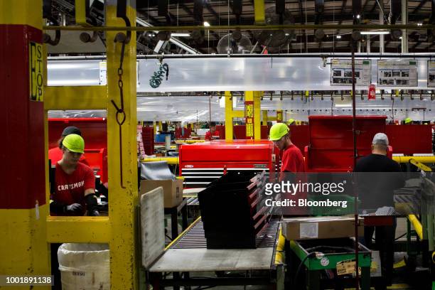 Workers assemble steel tool chests at a Stanley Black & Decker Inc. Craftsman Tools manufacturing facility in Sedalia, Missouri, U.S., on Tuesday,...