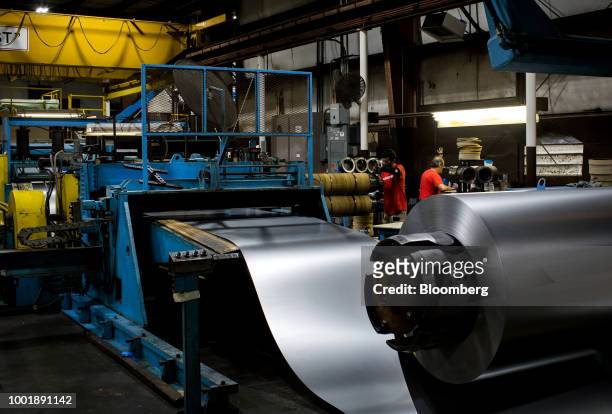 Metal moves through a flattening machine at a Stanley Black & Decker Inc. Craftsman Tools manufacturing facility in Sedalia, Missouri, U.S., on...