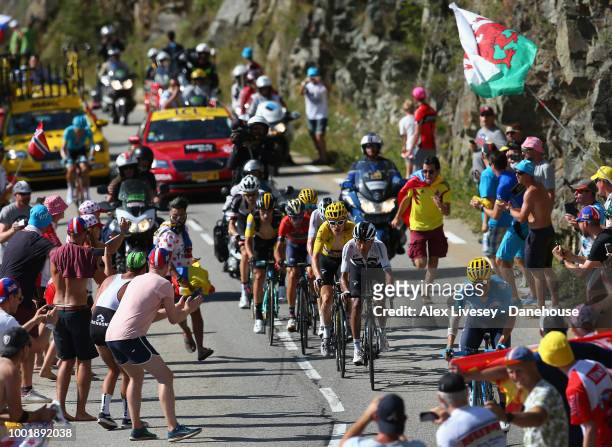 Geraint Thomas of Great Britain and Team Sky wearing the yellow jersey climbs up Alpe d'Huez on his way to victory during Stage 12, a 175.5km stage...