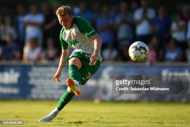 Georg Teigl of Augsburg scores the first goal for his team with a free kick during the pre-season friendly match between SC Olching and FC Augsburg...
