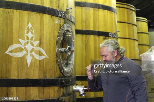 Winemaker Adi Badenhorst fetches a glass of Grenache from this year's harvest at his vinyard between Wellington and Paarl, South Africa, 20 July...