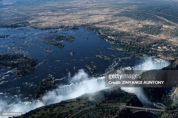 An aerial view taken on June 29, 2018 shows the site of the Victoria Falls on the Zambezi River at the border between Zambia and Zimbabwe.