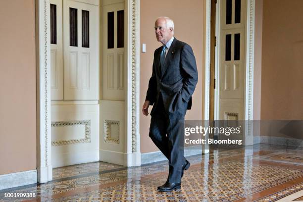 Senate Majority Whip John Cornyn, a Republican from Texas, walk to a meeting at the U.S. Capitol in Washington, D.C., U.S., on Thursday, July 19,...