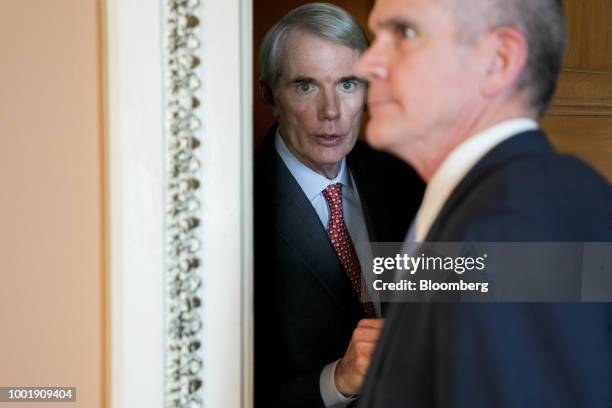 Senator Rob Portman, a Republican from Ohio, center, talks outside a meeting at the U.S. Capitol in Washington, D.C., U.S., on Thursday, July 19,...