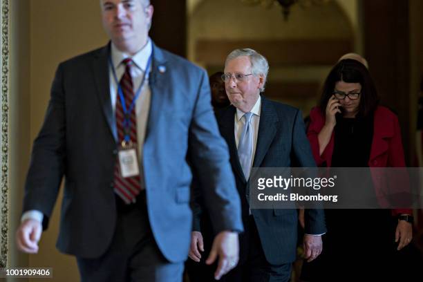 Senate Majority Leader Mitch McConnell, a Republican from Kentucky, center, walks to a meeting at the U.S. Capitol in Washington, D.C., U.S., on...