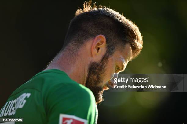Marcel Heller of Augsburg looks down during the pre-season friendly match between SC Olching and FC Augsburg on July 19, 2018 in Olching, Germany.