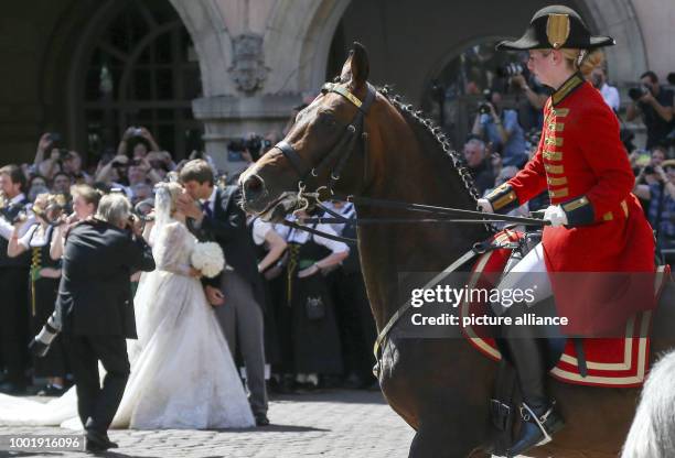 Prince Ernst August of Hanover and Ekaterina of Hanover kiss in front of the church after their church wedding at the Marktkirche church in Hanover,...