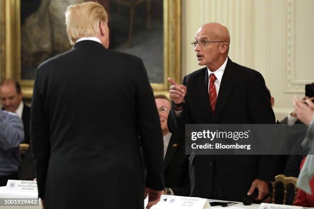 Chris Cortez, general manager of strategic programs for Microsoft Corp., right, speaks with U.S. President Donald Trump, during a 'Pledge to...