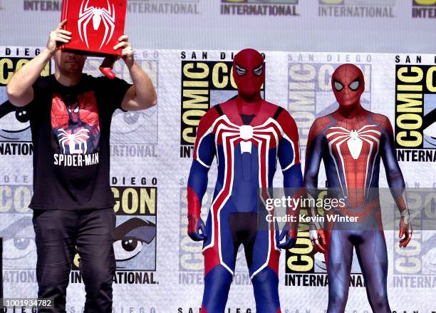 New Spider-man suits are revealed for the Spider-Man PS4 game onstage during the Marvel Games Panel during Comic-Con International 2018 at San Diego...