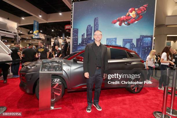 Hyundai Motor America Dean Evans poses with the Hyundai Kona Iron Man Edition at the Marvel booth during San Diego Comic-Con 2018 at San Diego...