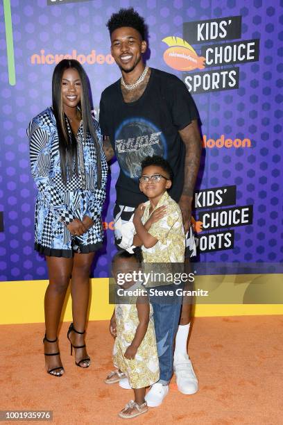 Keonna Green, Navi Young, Nick Young Jr., and NBA player Nick Young attend the Nickelodeon Kids' Choice Sports 2018 at Barker Hangar on July 19, 2018...