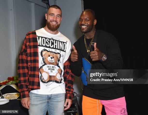 Players Travis Kelce and Martellus Bennett pose in the Green Room at the Nickelodeon Kids' Choice Sports 2018 at Barker Hangar on July 19, 2018 in...