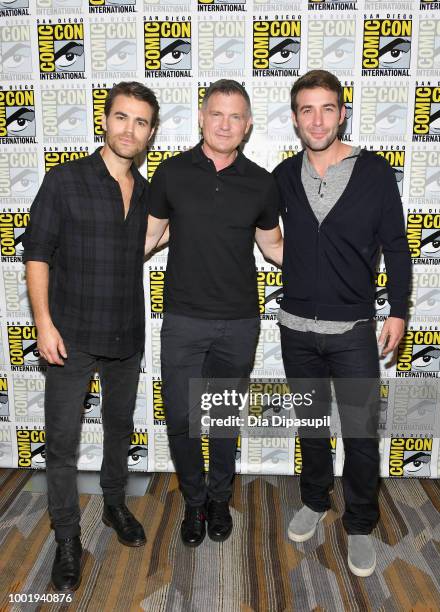 Paul Wesley, Kevin Williamson and James Wolk of 'Tell Me a Story' attend CBS Television Studios Press Line during Comic-Con International 2018 at...