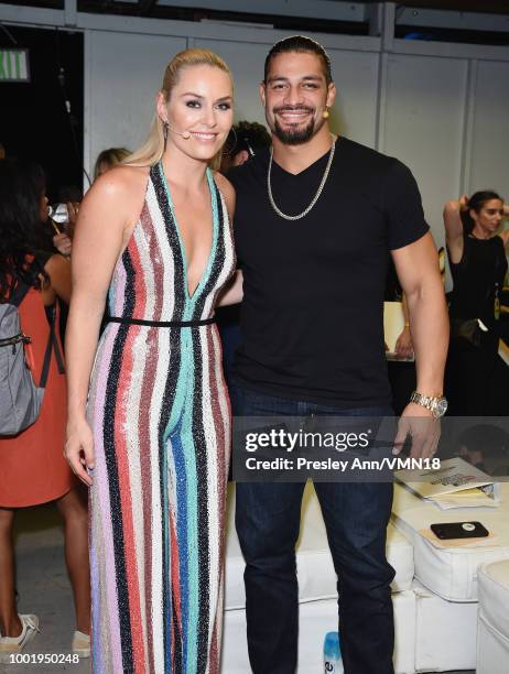 Skier Lindsey Vonn and wrestler Roman Reigns pose in the Green Room at the Nickelodeon Kids' Choice Sports 2018 at Barker Hangar on July 19, 2018 in...