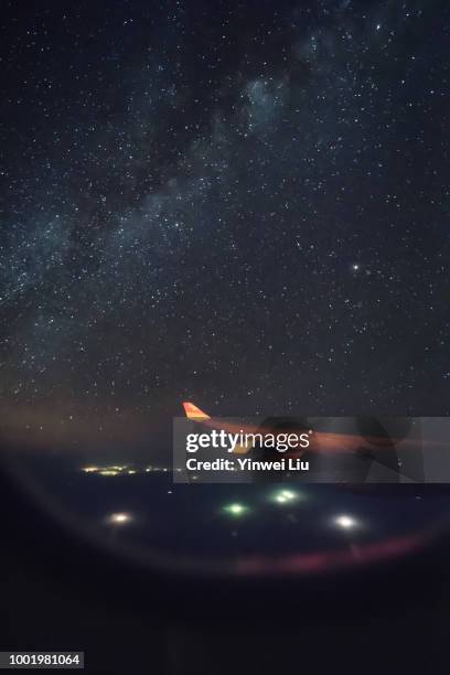 milky way galaxy,looking out of flight window - wing fotografías e imágenes de stock