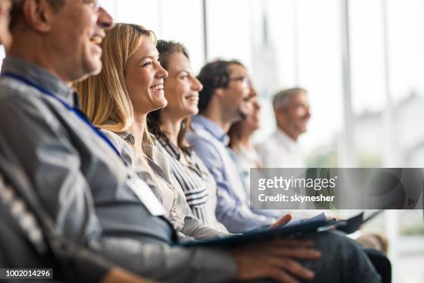 happy business people in a line on a training class in the office. - attendance imagens e fotografias de stock