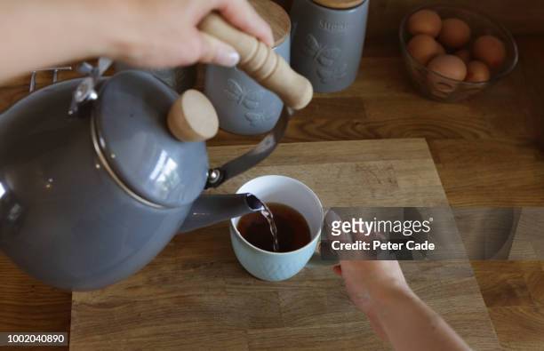 making cup of tea - close up table stock pictures, royalty-free photos & images