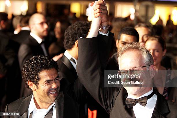 Actor Jamel Debbouze and Director of the Cannes Film Festival Thierry Fremaux depart the 'Outside Of The Law' Premiere at the Palais des Festivals...