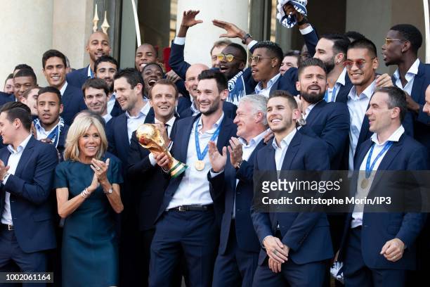 French national football team's players pose with French President Emmanuel Macron and French President Emmanuel Macron's wife Brigitte Macron before...