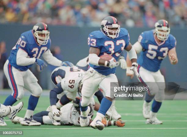 Gary Brown, Running Back for the New York Giants runs the ball during the National Football Conference East game against the Denver Broncos on 13...