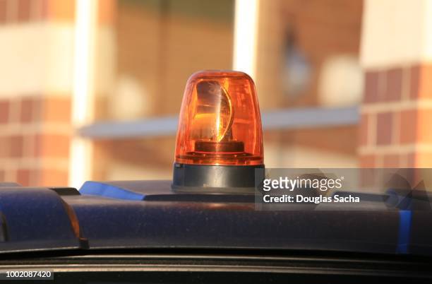 amber colored overhead flashing strobe light - highway patrol stockfoto's en -beelden