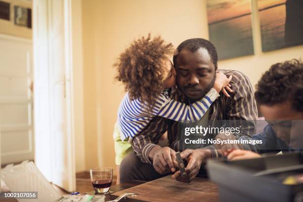 kids assisting their father repairing the shelf - blue collar worker family stock pictures, royalty-free photos & images