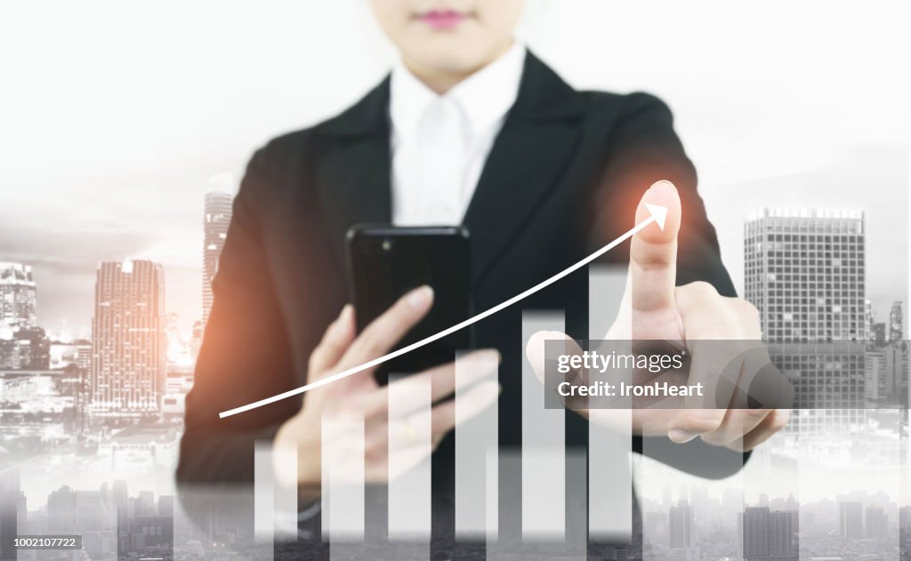 Info-graphic of business growth double exposure of woman is checking to smart phone to command business stock graph increasing.