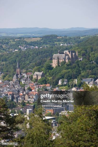 view over marburg an der lahn with the historic town centre in front of the landgrave's castle, university museum of cultural history and the lutheran church, marburg, hesse, germany - marburg stock-fotos und bilder