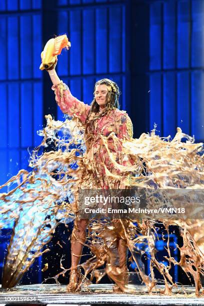 Honoree Danica Patrick is 'slimed' while accepting the Legend Award onstage during the Nickelodeon Kids' Choice Sports 2018 at Barker Hangar on July...