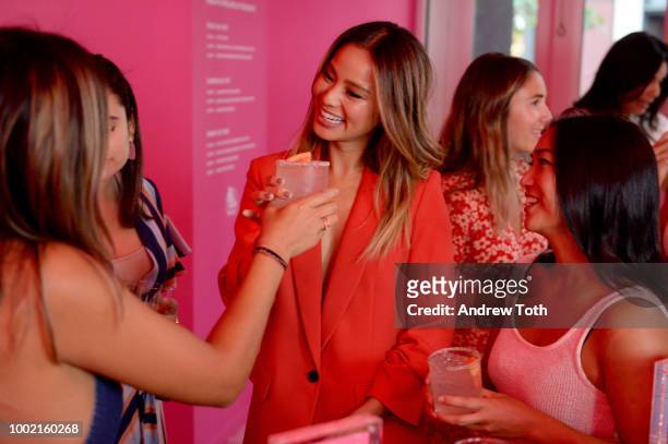 Jamie Chung enjoys Vita Coco with guests at the experiential pop-up "The Pop Shop By Vita Coco" at intimate launch party in SoHo on July 19, 2018 in...