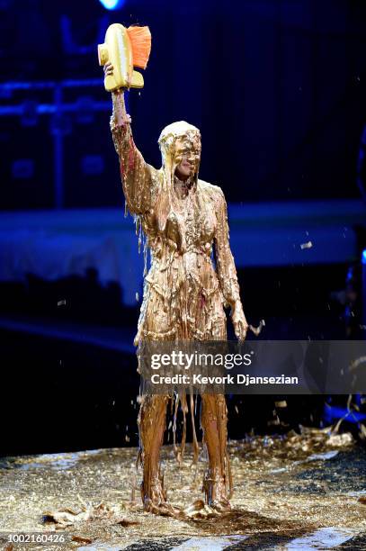 Honoree Danica Patrick reacts after being 'slimed' while accepting the Legend Award onstage during the Nickelodeon Kids' Choice Sports 2018 at Barker...