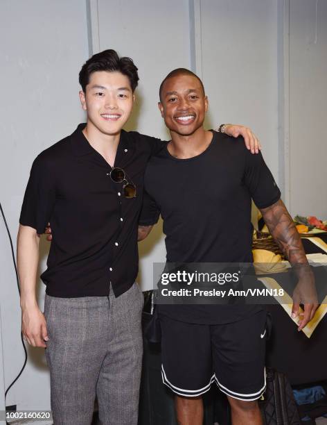 Figure skater Alex Shibutani and NBA player Isaiah Thomas pose in the Green Room at the Nickelodeon Kids' Choice Sports 2018 at Barker Hangar on July...