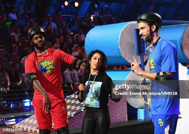 Host Chris Paul, Liza Koshy and Michael Phelps participate in a challenge during the Nickelodeon Kids' Choice Sports 2018 at Barker Hangar on July...