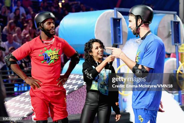 Host Chris Paul, Liza Koshy and Michael Phelps participate in a challenge during the Nickelodeon Kids' Choice Sports 2018 at Barker Hangar on July...