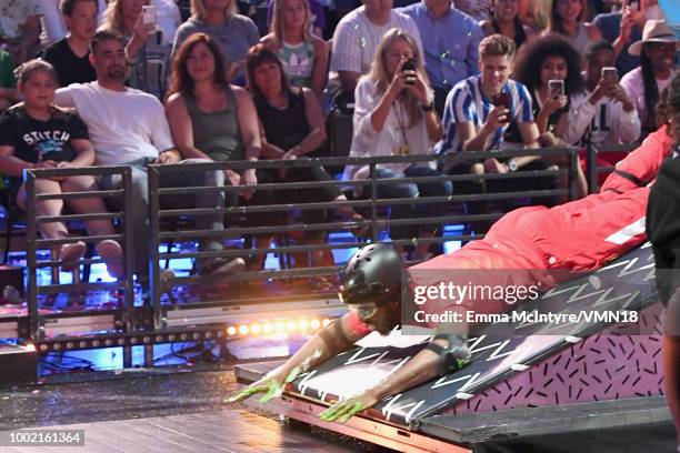 Host Chris Paul participates in a challenge during the Nickelodeon Kids' Choice Sports 2018 at Barker Hangar on July 19, 2018 in Santa Monica,...