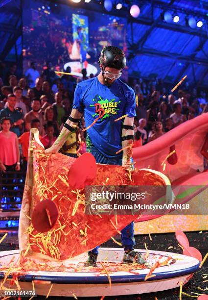Michael Phelps participates in a challenge during the Nickelodeon Kids' Choice Sports 2018 at Barker Hangar on July 19, 2018 in Santa Monica,...