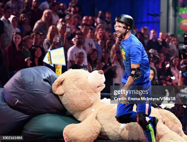 Michael Phelps participates in a challenge during the Nickelodeon Kids' Choice Sports 2018 at Barker Hangar on July 19, 2018 in Santa Monica,...