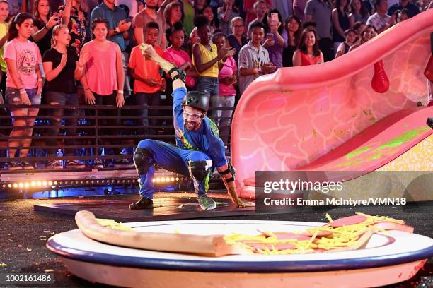 Michael Phelps participates in a challenge during the Nickelodeon Kids' Choice Sports 2018 at Barker Hangar on July 19, 2018 in Santa Monica,...