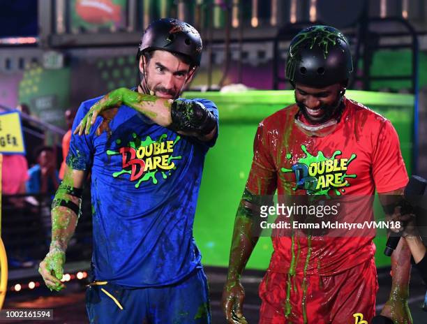 Michael Phelps and host Chris Paul participate in a challenge during the Nickelodeon Kids' Choice Sports 2018 at Barker Hangar on July 19, 2018 in...