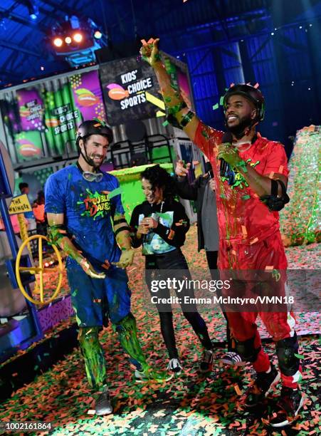 Host Chris Paul, Liza Koshy, Marc Summers and Michael Phelps participate in a challenge during the Nickelodeon Kids' Choice Sports 2018 at Barker...