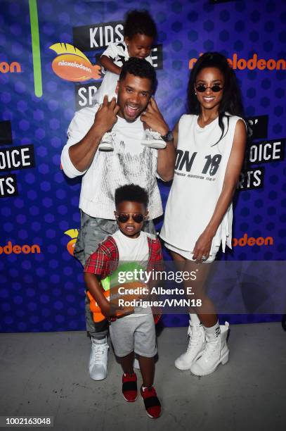 Player Russell Wilson, winner of the Best Cannon award, Future Zahir Wilburn, Sienna Princess Wilson and Ciara pose backstage at the Nickelodeon...