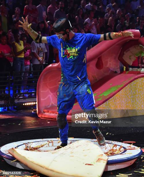 Michael Phelps participates in a challenge during the Nickelodeon Kids' Choice Sports 2018 at Barker Hangar on July 19, 2018 in Santa Monica,...