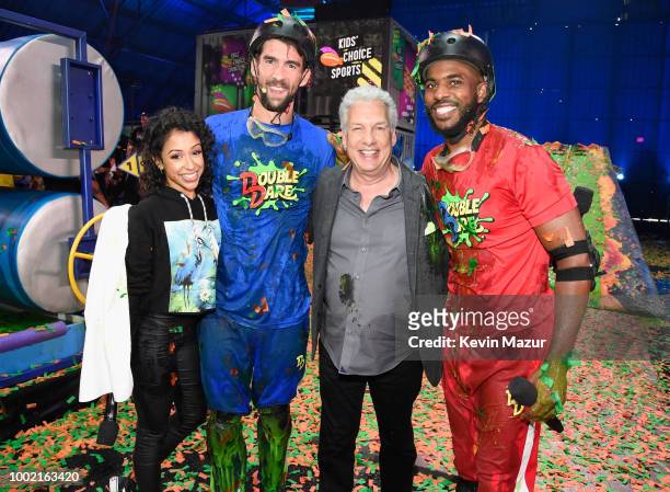 Liza Koshy, swimmer Michael Phelps, Marc Summers, and host Chris Paul pose during the Nickelodeon Kids' Choice Sports 2018 at Barker Hangar on July...