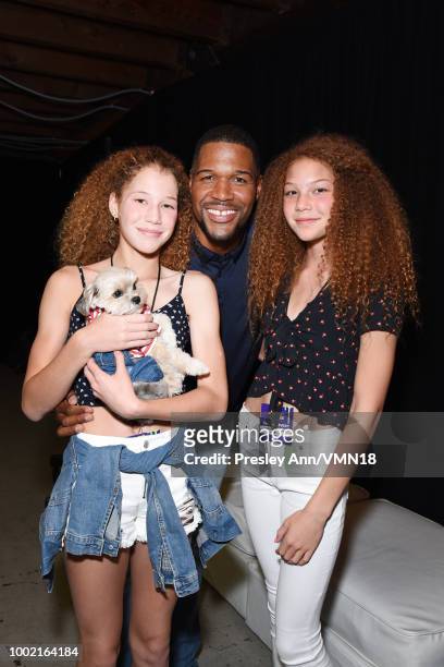 Former NFL player Michael Strahan , Sophia Strahan, Isabella Strahan, and Leroy Brown aka Leroy The Good Boy pose in the Green Room at the...