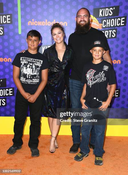 Wrestler Ronda Rousey and mixed martial artist Travis Browne arrives at the Nickelodeon Kids' Choice Sports Awards 2018 at Barker Hangar on July 19,...
