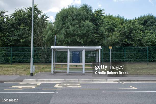 bus shelter and trees - bus shelter ストックフォトと画像