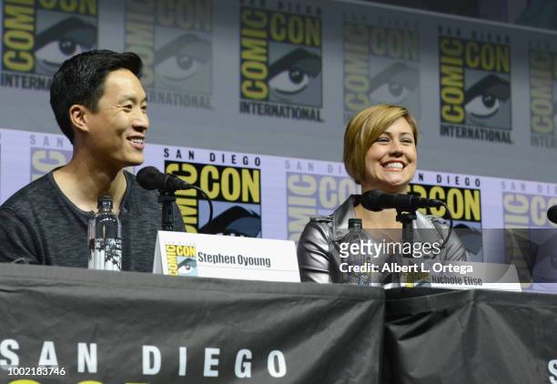 Stephen Oyoung and Nichole Elise speak onstage during the Marvel Games Panel during Comic-Con International 2018 at San Diego Convention Center on...