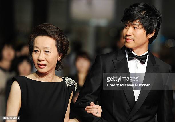 Actress Yuh-Jung Youn and Joonsang Yu attend the 'Ha Ha Ha' Premiere at the Palais des Festivals during the 63rd Annual Cannes Film Festival on May...