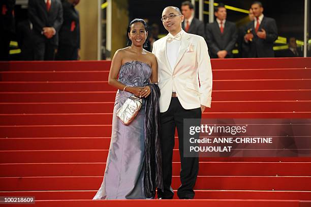 Thai director Apichatpong Weerasethakul and Thai actress Wallapa Mongkolprasert arrive for the screening "Lung Boonmee Raluek Chat" presented in...